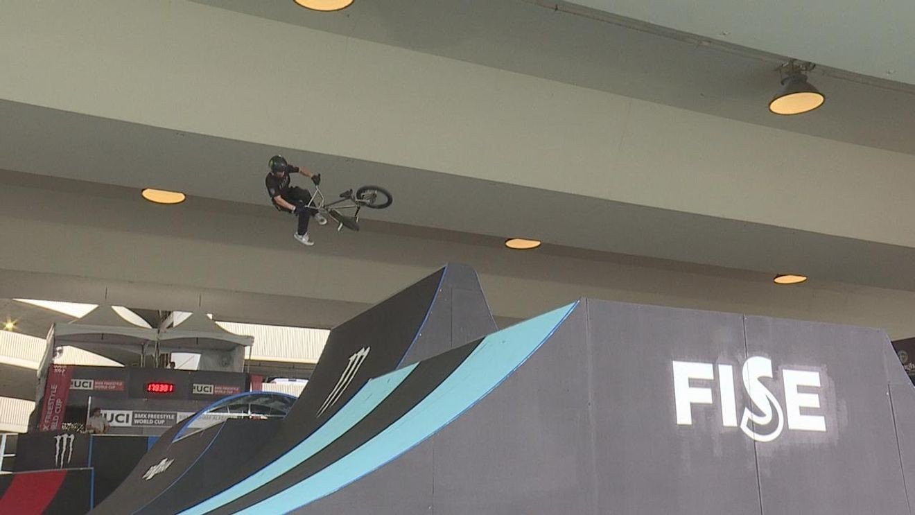 BMX rider mid-air at the FISE World Series at City Walk